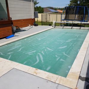 White 500 Micron Pool Cover over a light coloured pool