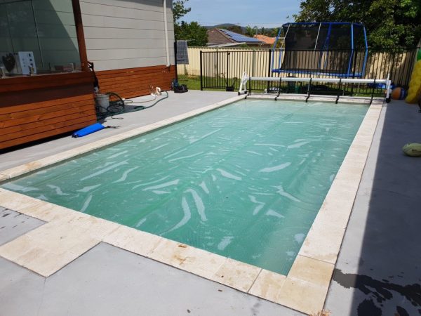 White 500 Micron Pool Cover over a light coloured pool